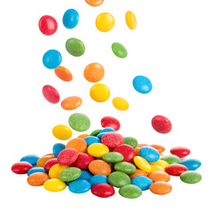 Colorful candies scattered and falling in a vibrant display. white background