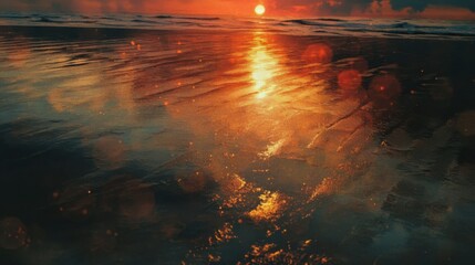 The beach sunset reflected beautifully on the wet sand