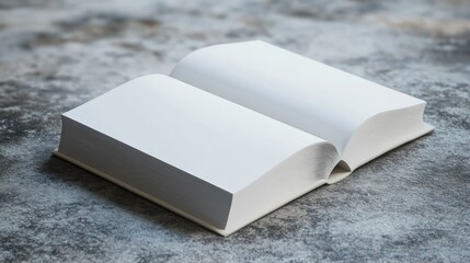 Fototapeta premium Open book on a textured surface