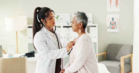 Doctor, stethoscope and senior woman in office for cardiology, listen to heartbeat and healthcare...