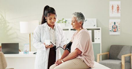Test, consultation and doctor with mature patient for blood pressure exam, healthcare and care in...