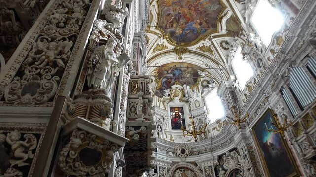 Gimbal footage of beautiful frescoes, decorating the ceiling and dome of the impressive Chiesa del Gesu church in Palermo, Italy
