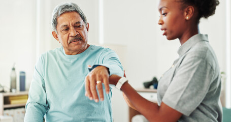 Obraz premium Physiotherapist, woman and senior man with arm, assessment and support for recovery at clinic. People, helping hand and care for injury with exercise, advice and services for wellness at hospital