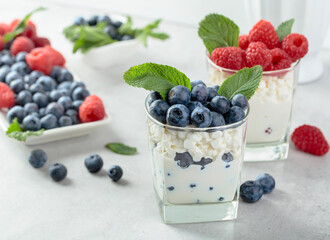 Homemade curd cheese served with fresh blueberries and raspberries.