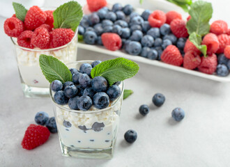 Homemade curd cheese served with fresh blueberries and raspberries.