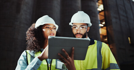Woman, man and engineer on tablet at construction site, review and planning for urban expansion in...