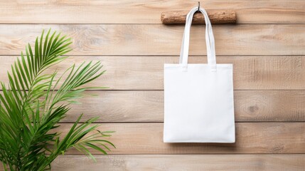 White Tote Bag Mockup on Rustic Wooden Wall with Green Plant