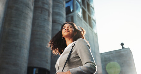 Buildings, commute and thinking with businesswoman in city for idea, inspiration or travel. Hope, opportunity and vision with corporate professional outdoor in urban town for new job from below