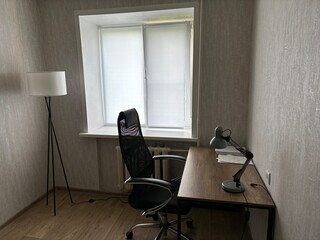 a spacious, bright bedroom with a place to work