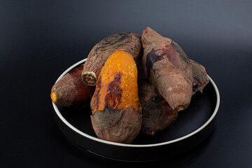 Roasted Sweet Potato isolated (yaki imo) on black background