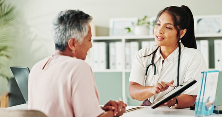 Obraz premium Appointment, healthcare or tablet with doctor and patient in office of hospital for consulting. Conversation, feedback or medical report with medicine professional and mature woman in clinic