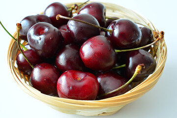a close up of A Basket of Fresh Ripe Cherries