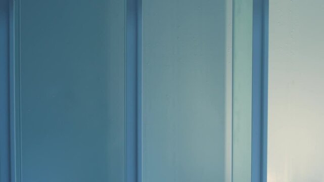 Hand opens new empty refrigerator with no food, empty shelves of home refrigerator, vertical video