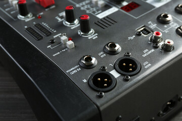 Professional mixing console on table, closeup. Radio studio equipment