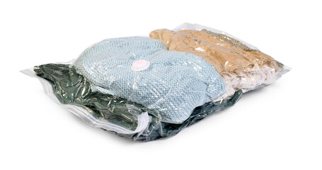 Compressed vacuum bag with clothes isolated on white