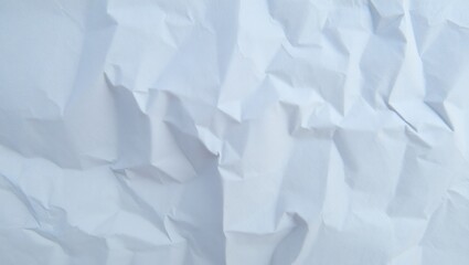 Obraz premium Crumpled white paper texture with wrinkles and creases