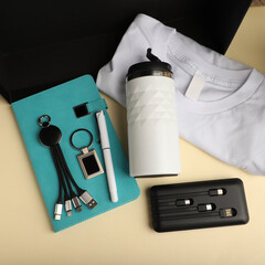 Assorted Promotional Products Set with Notebook, Tumbler, and Accessories. Concept photo shoot.