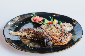 Fried pork chops with vegetables sauce and herbs