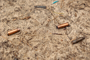 spent cartridges scattered on the ground