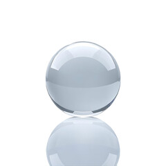 A clear glass sphere resting on a reflective surface against a stark black background in studio shot