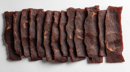 Thin slices of jerky, showing a rich, dark texture with visible marbling