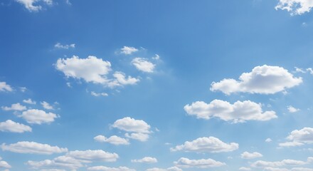 Fototapeta premium Cloudy blue sky with soft white clouds in a serene atmosphere
