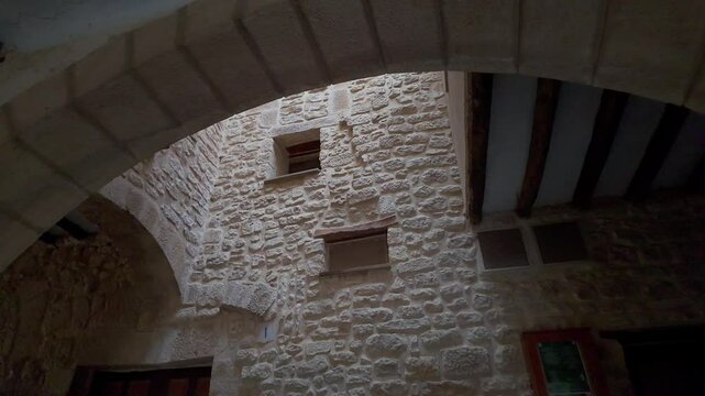 Interior architecture with small courtyards and stone houses in Calaceite, Matarrana, Teruel.