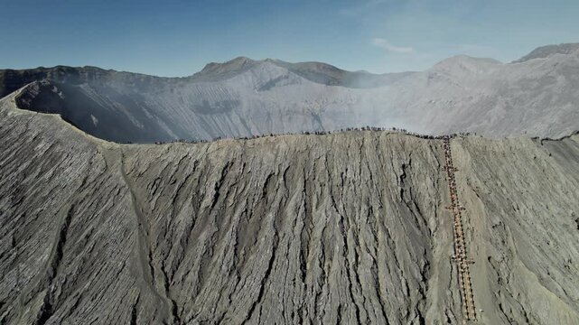 Aerial view of tourists walking on mount bromo crater rim
