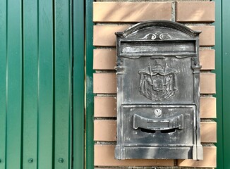 mailbox for correspondence of a country house hangs on the wall