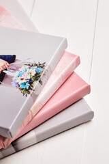 A neatly stacked set of stretched canvas prints with gallery wrapping in soft pastel colors. The...