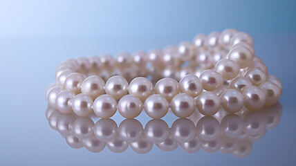 Exquisite pearl necklace arranged on a reflective surface, highlighting its luster.