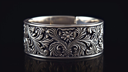 Gleaming silver bracelet with intricate patterns, capturing the essence of craftsmanship.