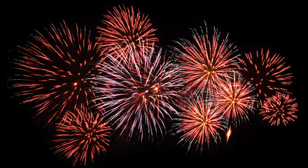 Spectacular display of vibrant fireworks exploding against a night backdrop
