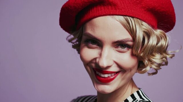 vibrant, retro-inspired close-up portrait of a smiling woman in a bold red beret and black-and-white striped top, standing confidently against a soft pastel lilac background. 