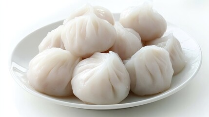 Steamed Dumplings Served on White Plate with Soft Lighting