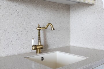 kitchen faucet on a stylish metal sink