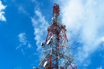 Radio, communication and cell towers on blue sky background
