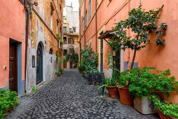 Old cozy street in Trastevere, Rome, Italy. Trastevere is rione of Rome, on west bank of Tiber in Rome. Architecture and landmark of Rome