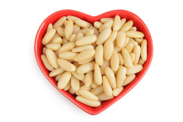 Shelled European pine nuts in ceramic bowl isolated on white background with full depth of field. Top view. Flat lay
