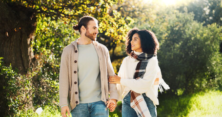 Outdoor, holding hands and couple on walk, talking and people with smile on date, romance or break....