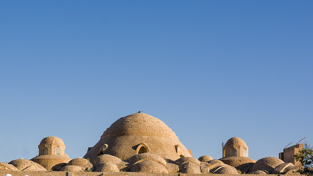 Domed roofs in the historical center of Bukhara with bazaar Toqi Sarrofon