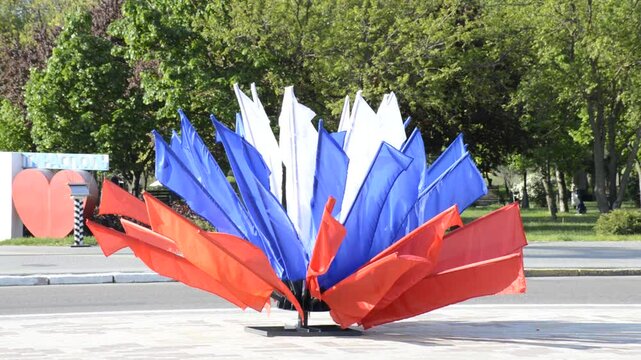 national flag of Russia on the central square of the city of Tiraspol, Transnistria. flags flutter in the wind. unity of the fraternal peoples of the former Soviet Union