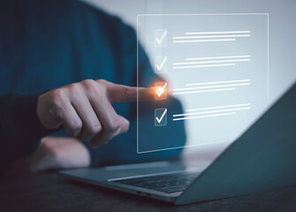 Businessman checklist concept as clipboard document checklist form on the virtual screen Use your...