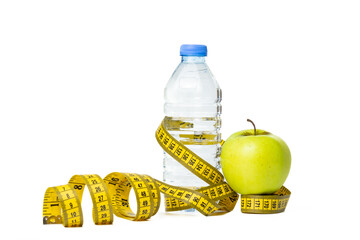 Bottle of water, measuring tape and apple isolated on white background