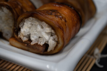 Vegan sushi rice rolled in teriyaki eggplant slices