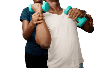 Black African female  fitness instructor assisting man is exercising with dumbbells. Fitness coach, physiotheraphy
