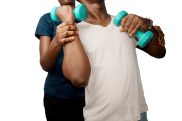 Black African female  fitness instructor assisting man is exercising with dumbbells. Fitness coach, physiotheraphy
