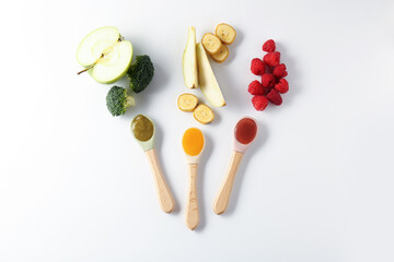 Baby food. Tasty puree in spoons and different ingredients on white background, flat lay