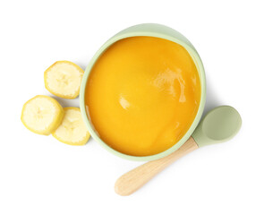 Baby food. Tasty puree in bowl, banana and spoon isolated on white, top view