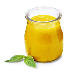 Tasty curry sauce in glass jar and basil isolated on white